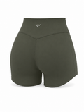 DUAL Short in Verde, a high waisted activewear short shown from the back